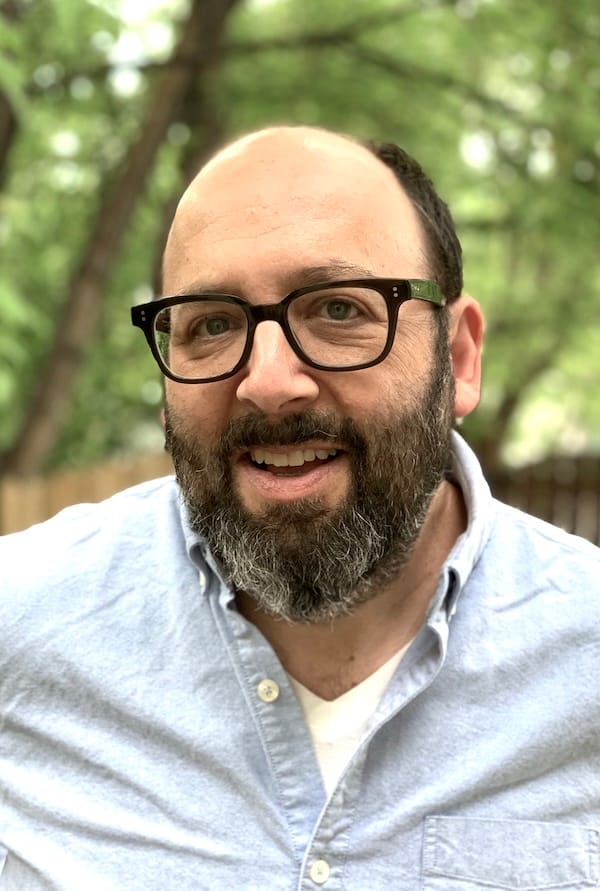 Portrait of Andrew Boardman outside - he has glasses and a beard 