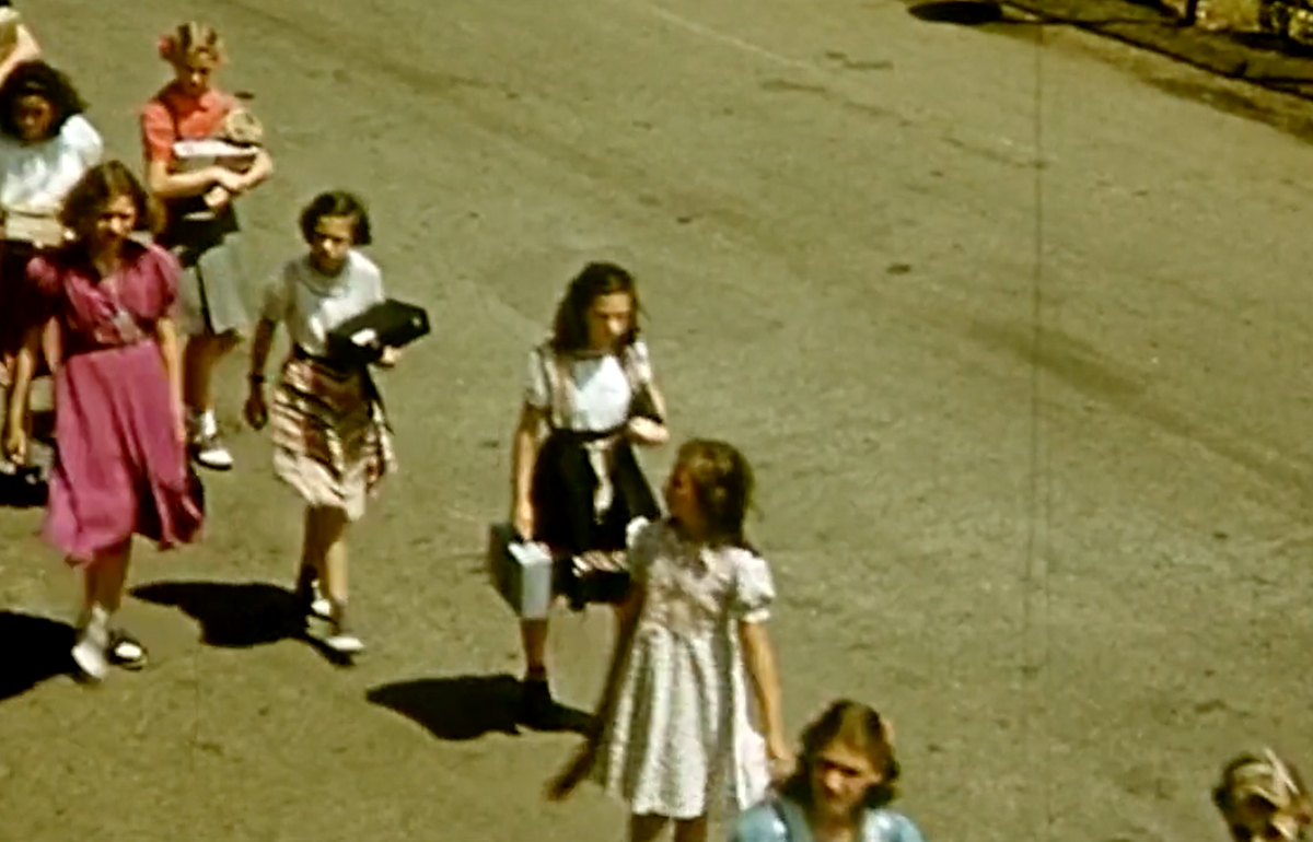 children walking in line with teacher